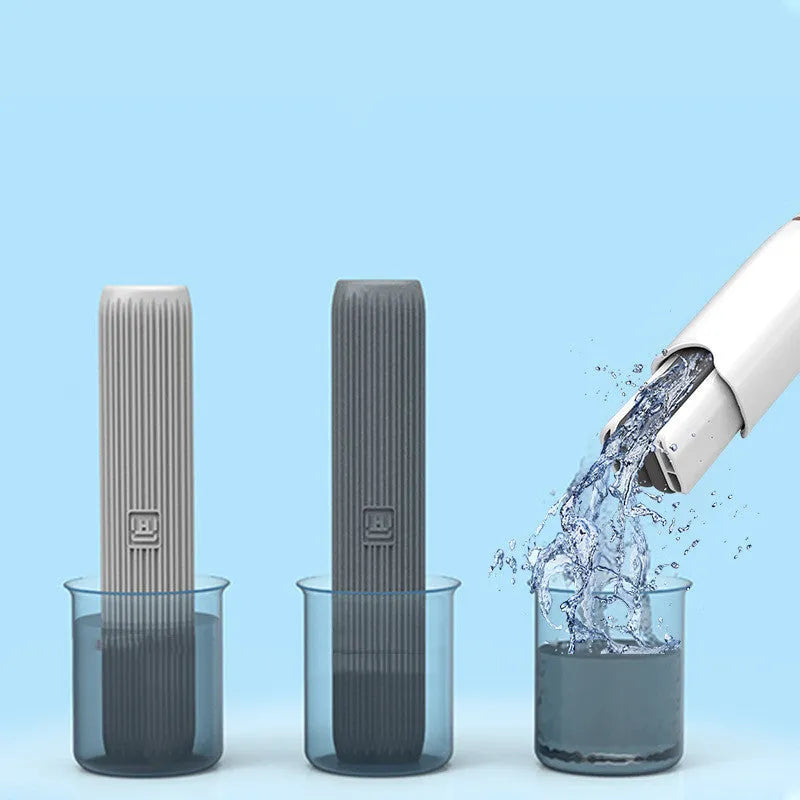 Mini plastic squeeze mop with a blue biodegradable cotton head and a push-pull dehydration ring on the handle.
