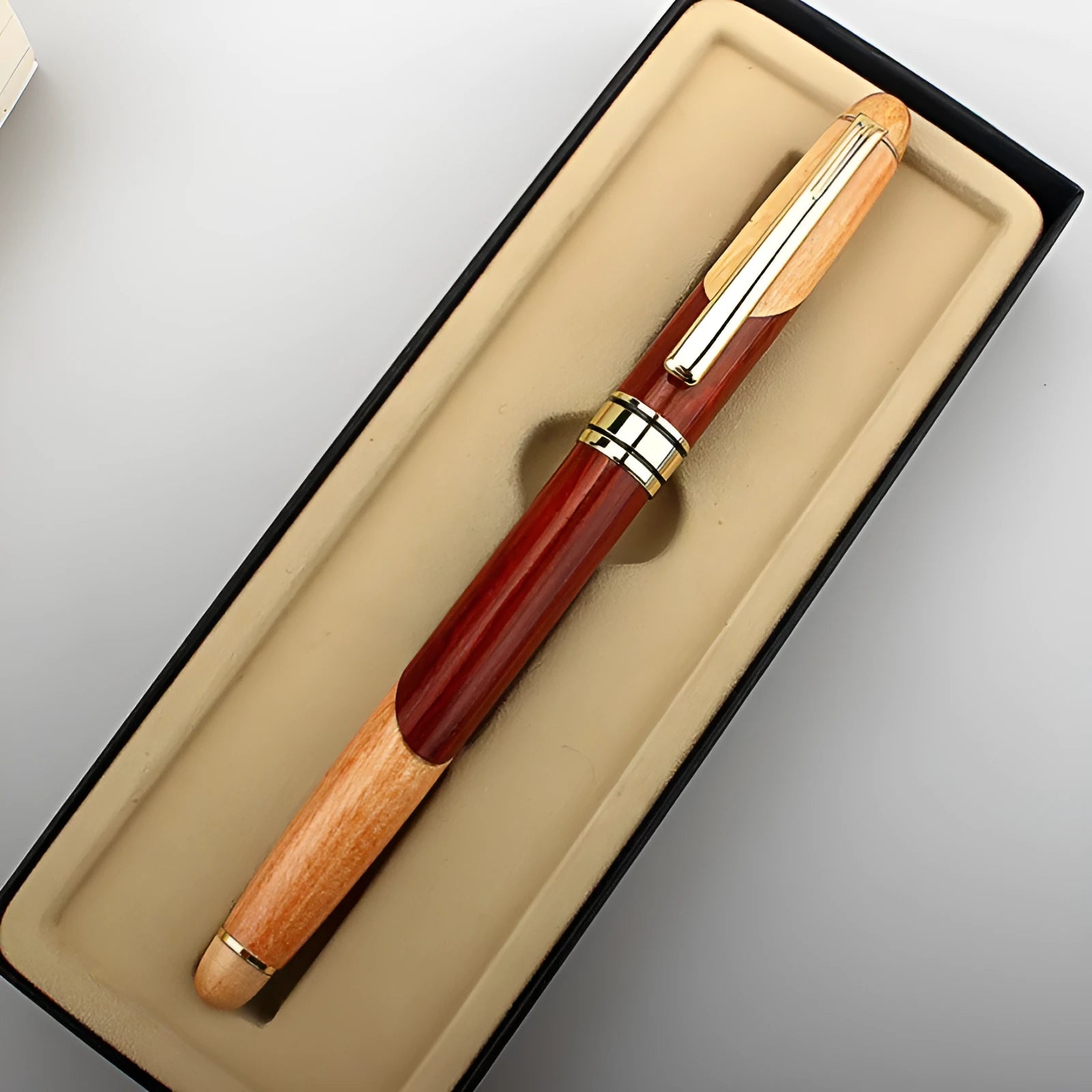 Wooden and metal pen for office use shown with a protective storage bag.