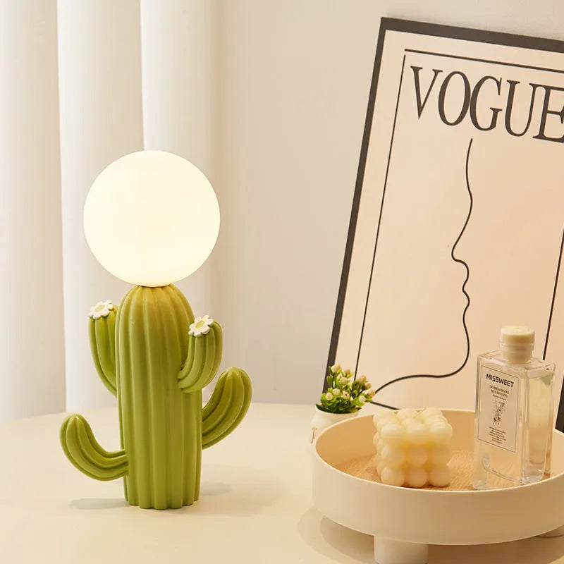 Green cactus button desk lamp with three-colour accents on a bedside table in a child's room