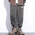 Men's grey straight leg sweatpants with an ankle tie strap, laid flat.
