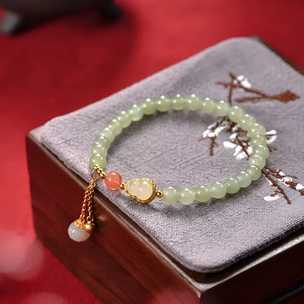 Jade and gold plated women's bracelet with fu character charm and Chinese knot fastening