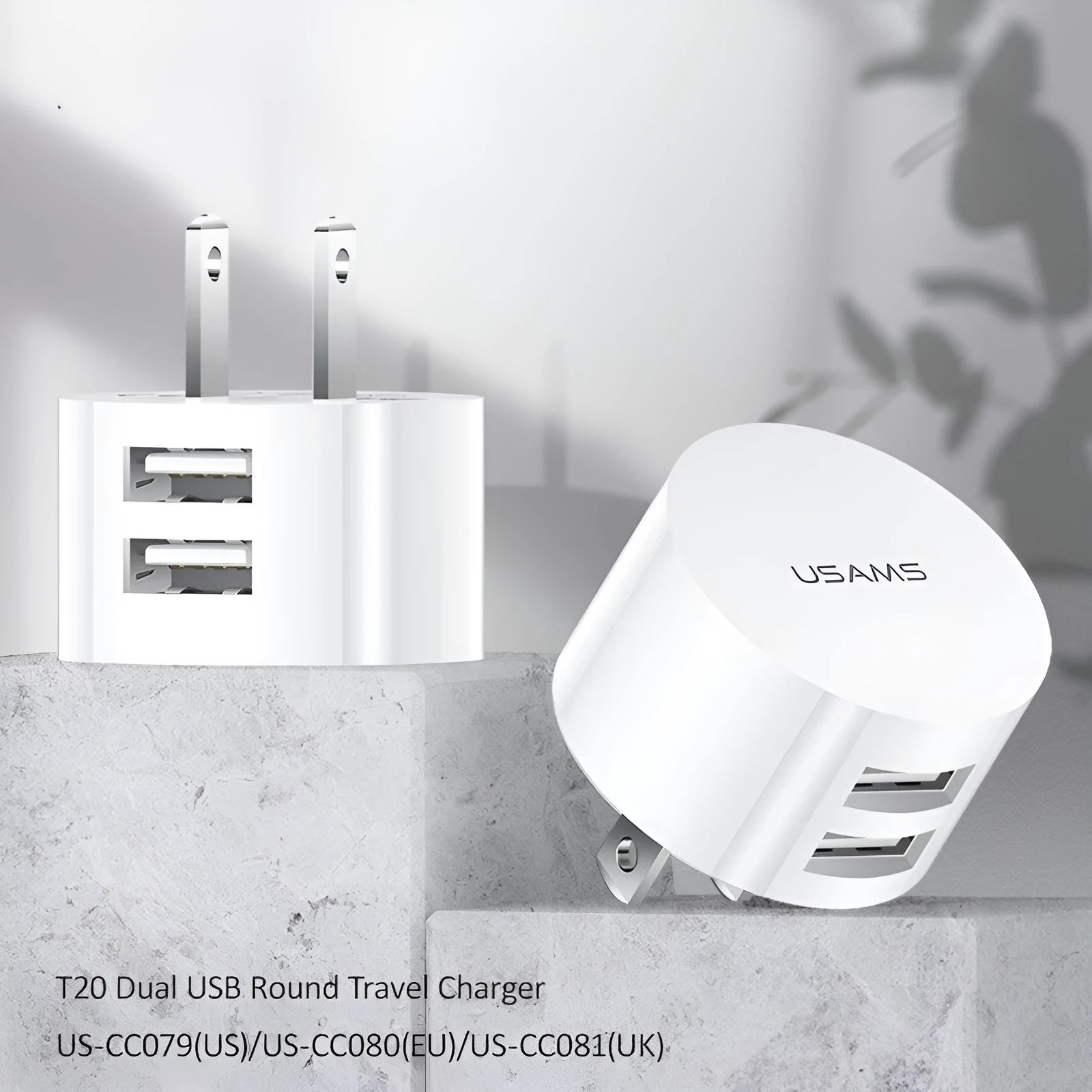 White portable universal dual USB phone charger with US, EU, and UK plug heads