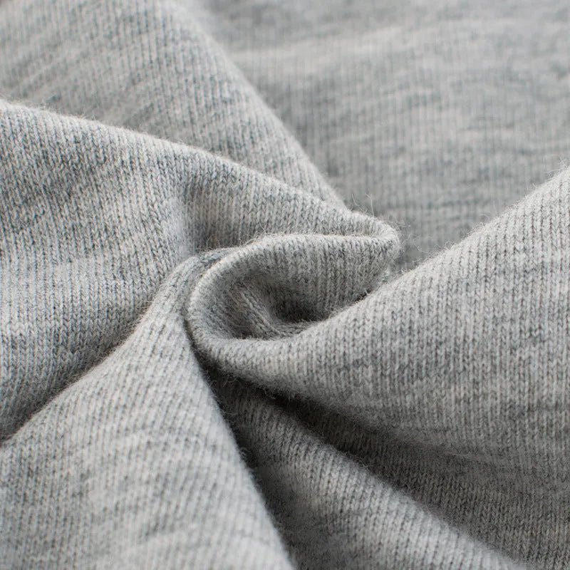 Grey cotton children's t-shirt laid flat, showing Asian size tags for 90cm, 100cm, 110cm, 120cm, 130cm, and 140cm lengths.