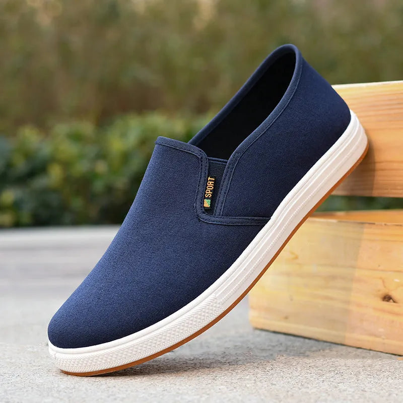 Men's black and blue slip-on canvas cloth shoes with round toe and injection moulded sole