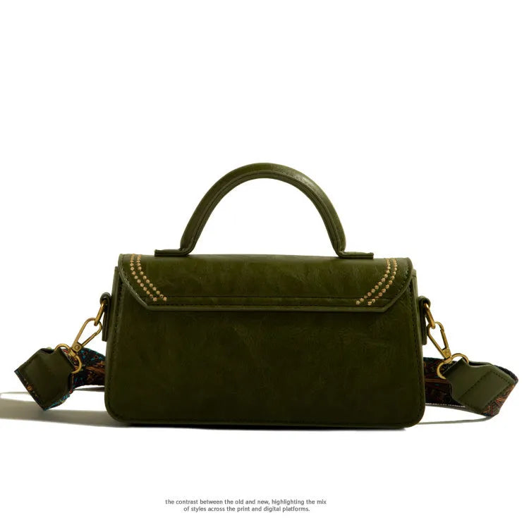 Brown retro women's messenger bag made of PU leather showing sewing thread detail and sandwich pocket.