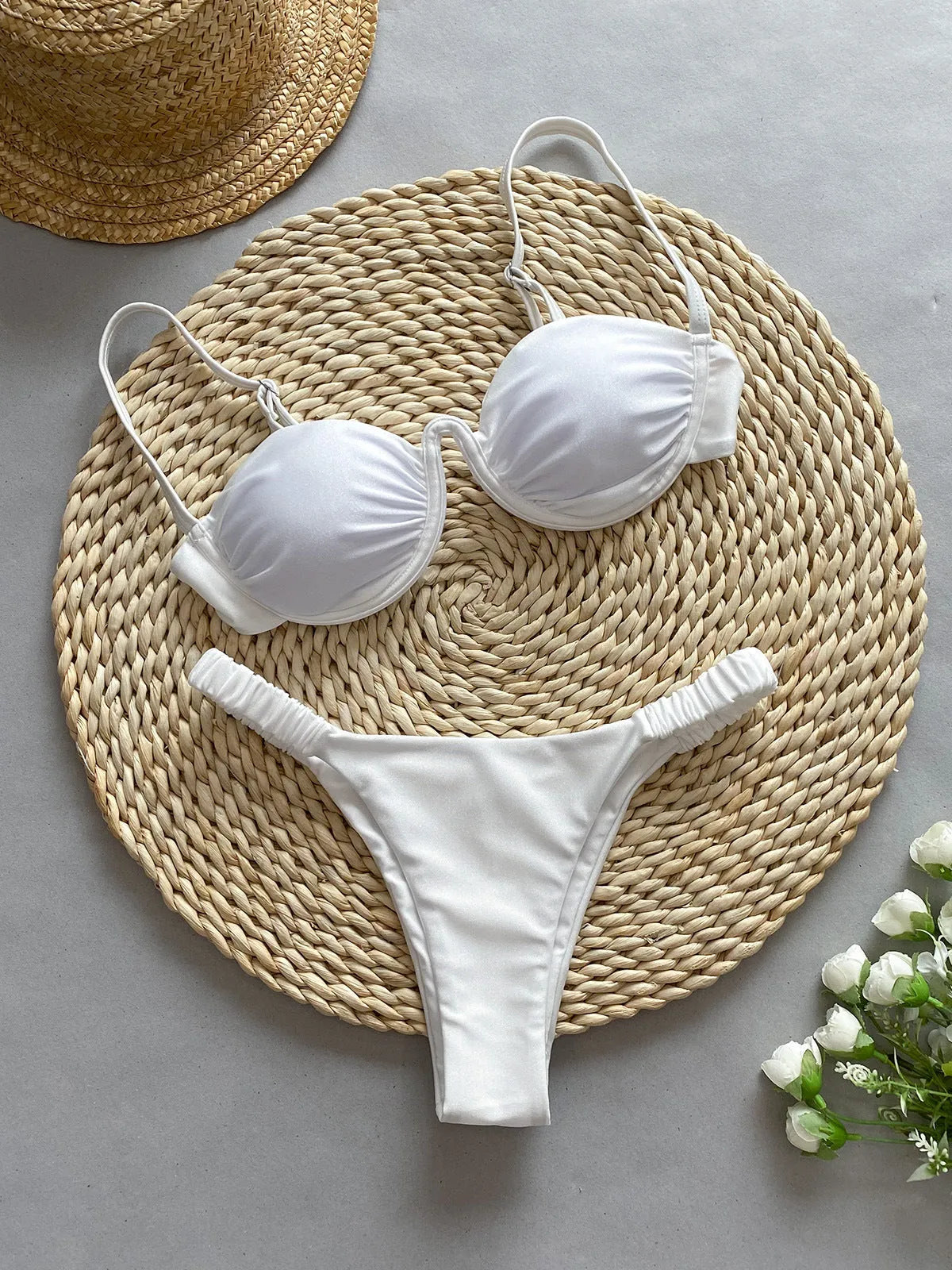 Women's black underwire bikini swimsuit set on a model, showing brief-style fit.
