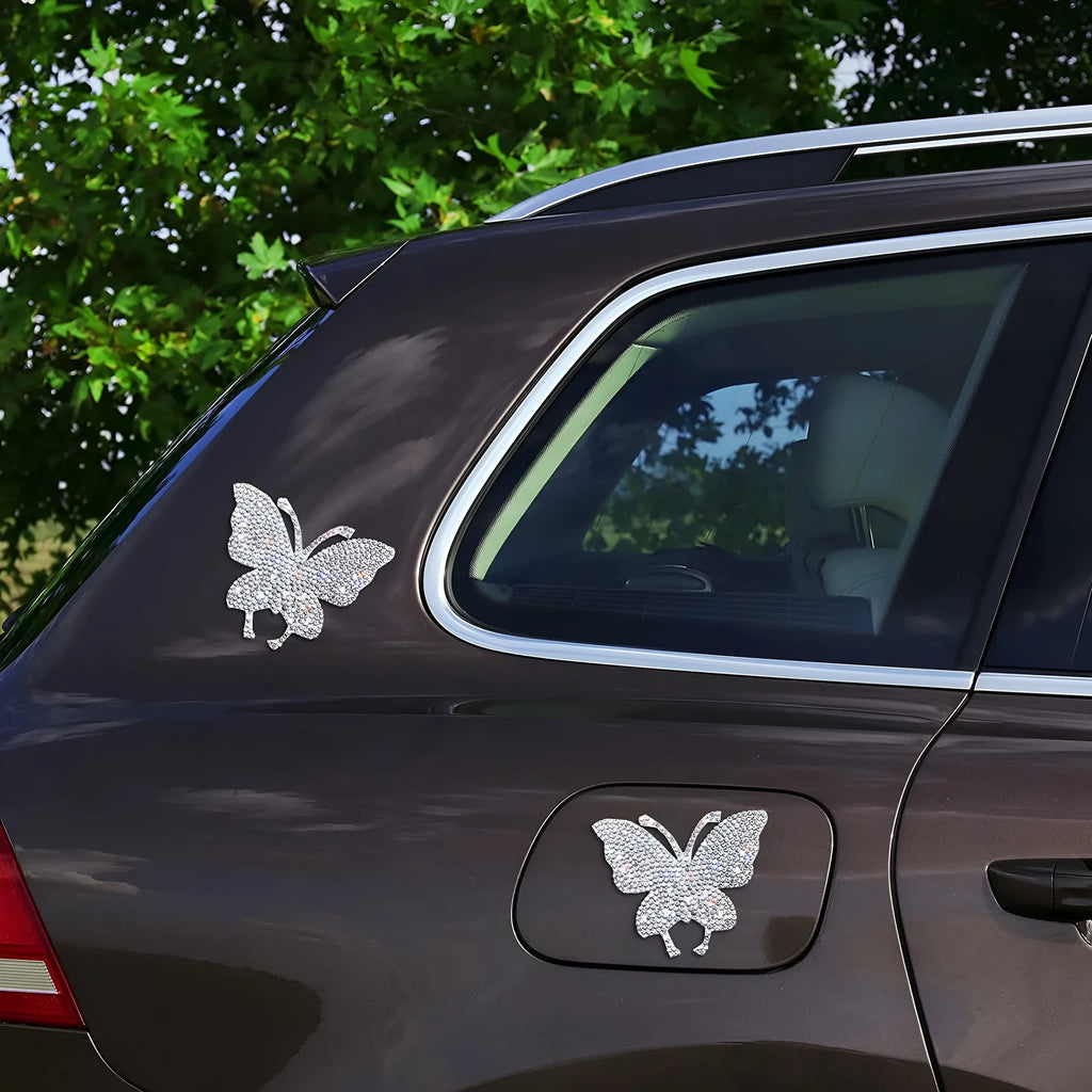 Glass car sticker patch with diamond crystals in bear claw or butterfly design, 7cm by 6cm.