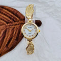 Women's stainless steel watch with round dial and 9mm thickness showing gold face option
