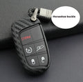 Carbon fibre pattern silicone protective case for a Dodge, Chrysler, or Fiat car key remote with a large head buckle.