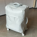 Ultra-light waterproof Oxford cloth suitcase in bluestone green with universal wheels, shown in 20-inch size