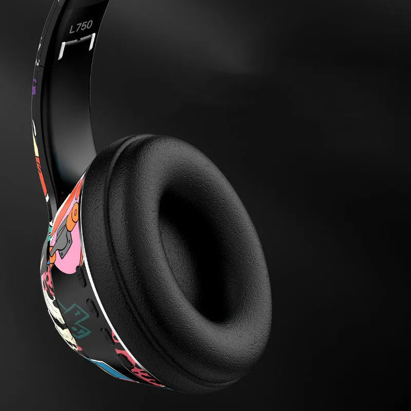Black and white wireless Bluetooth headset with head-mounted design for sports and gaming.