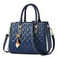Women's simple shoulder messenger bag in black polyester with large capacity and internal pockets.