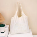 Korean-style 3D Letter shoulder bag with minimalist embroidery in nylon, available in four colours