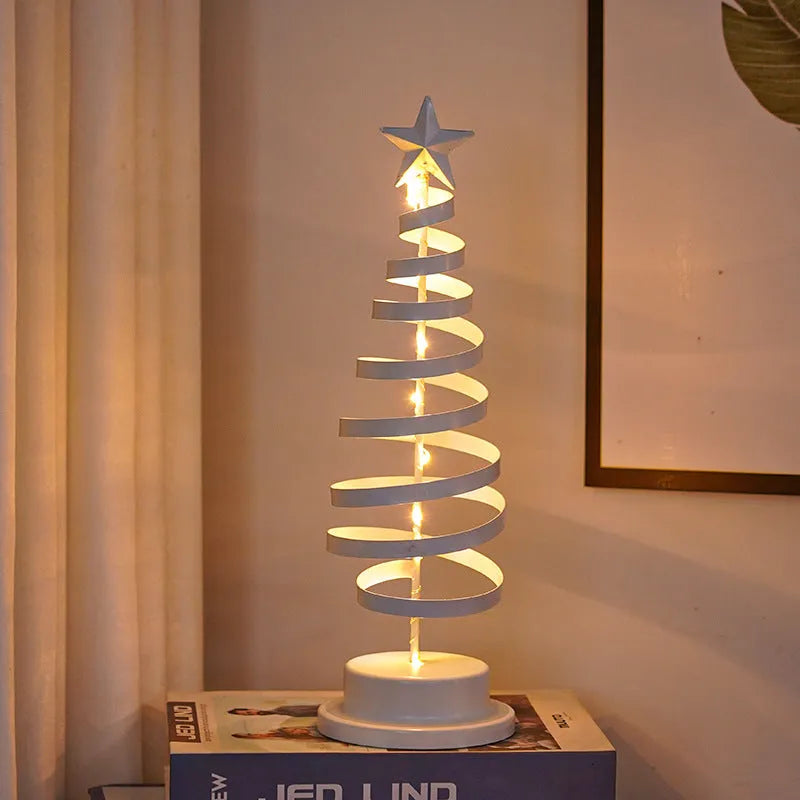 33cm wrought iron Christmas tree spiral light ornament with warm white LED illumination on table