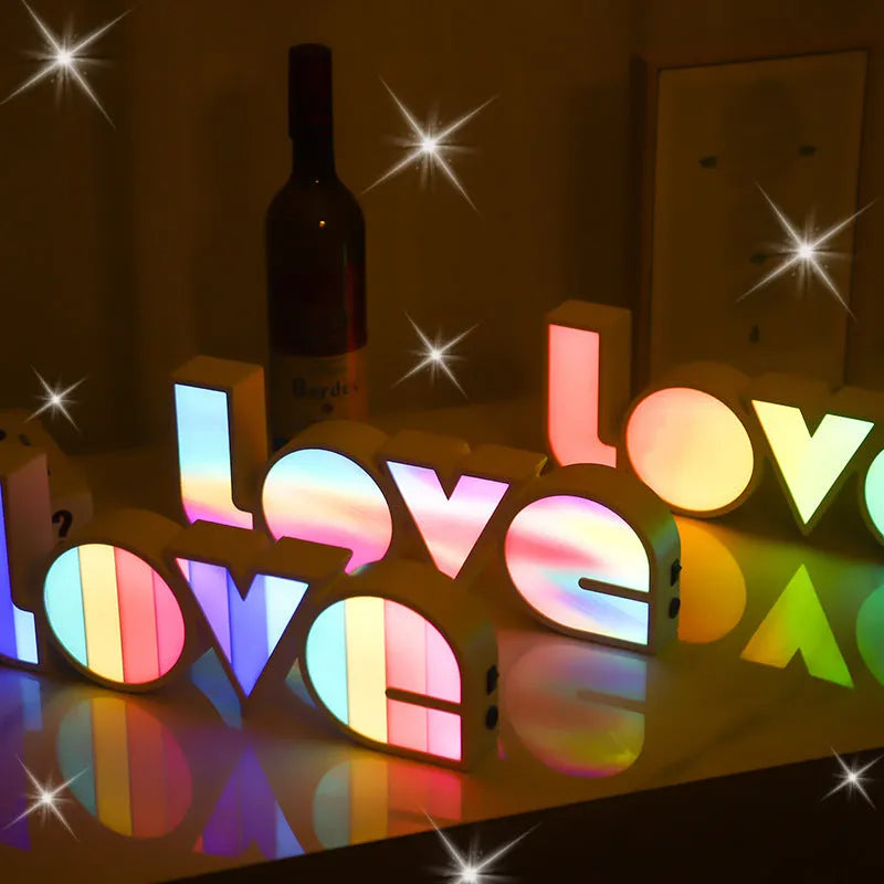 LED LOVE light decoration with rainbow-style lampshade showing romantic room illumination