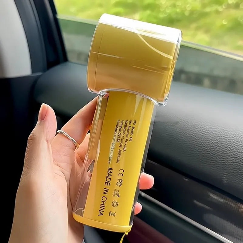 Portable handheld fan with refrigeration function in black, white or yellow colours showing compact design