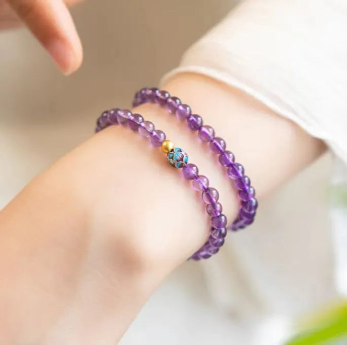 Retro mixed material bracelet with a detailed nine purple lotus design.
