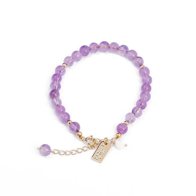 Women's lavender amethyst crystal bracelet with zodiac motif in dark and light colour options