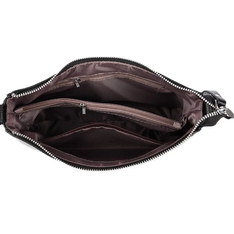 Genuine leather horizontal square shoulder crossbody bag with metal belt detail in beige colour