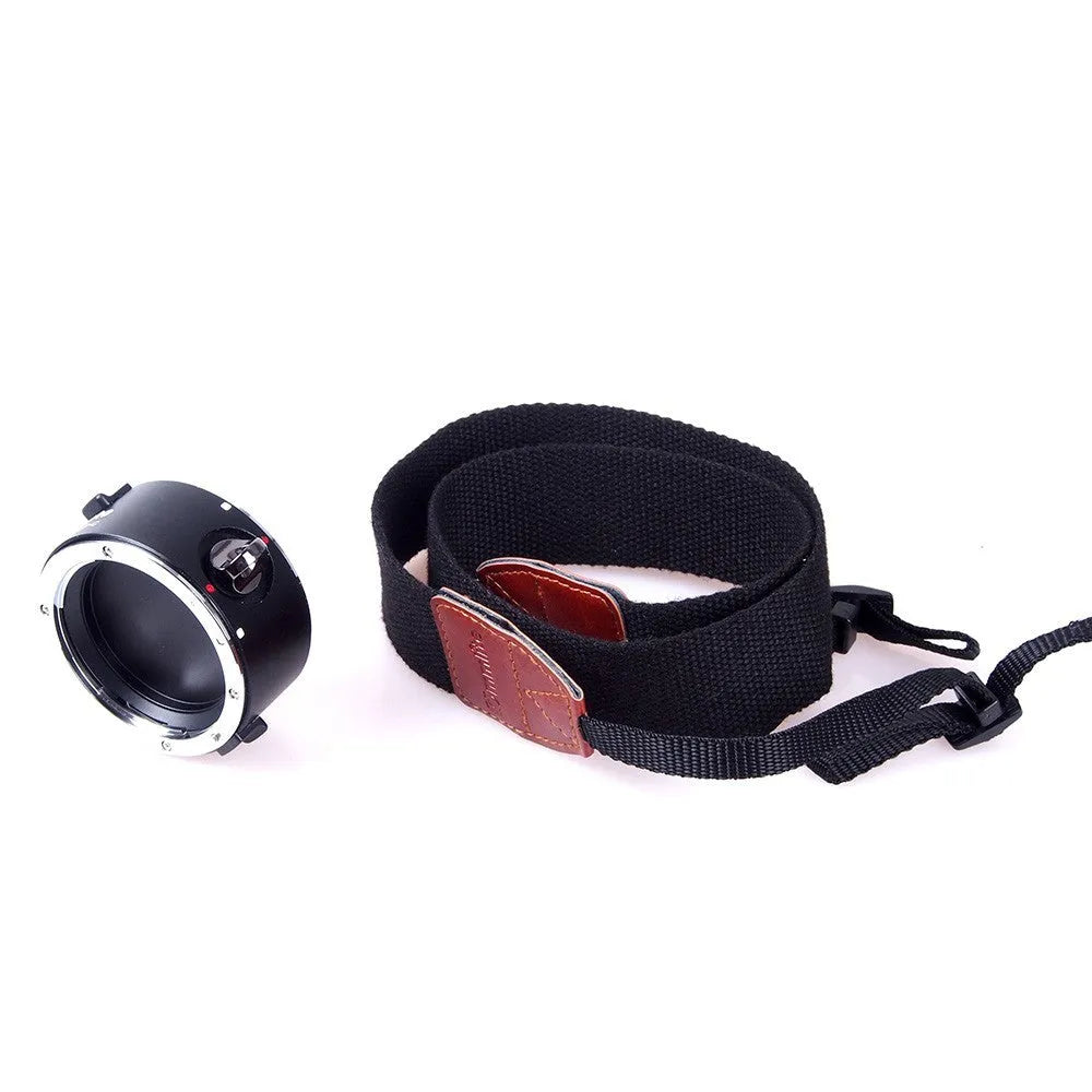 Aluminium camera lens flipper holder on a cotton shoulder strap for quick lens changes