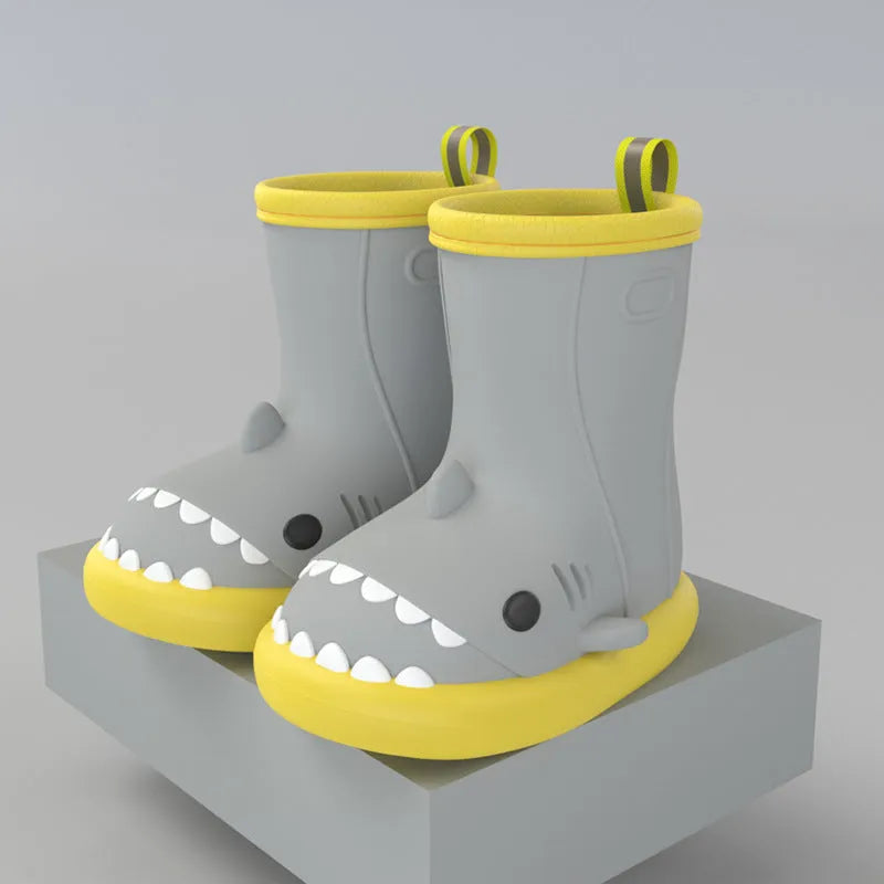 Shark and dinosaur design children's rain boots in green, available in multiple colours and sizes.