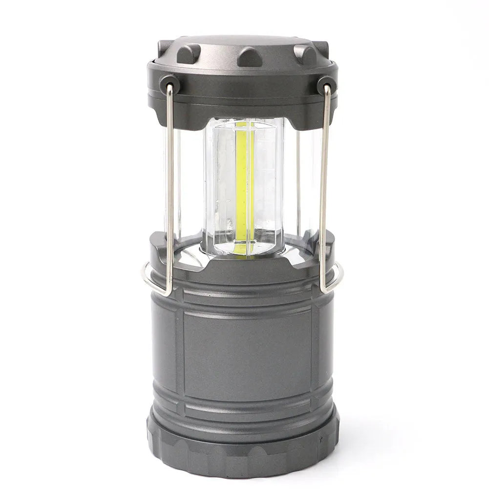 Multifunctional COB camping lantern in gold with solar panel, telescopic body, and stainless steel fold-away handles