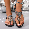 Women's bohemian sandals with rhinestone decoration on PVC upper, in blue colour with a rubber sole.