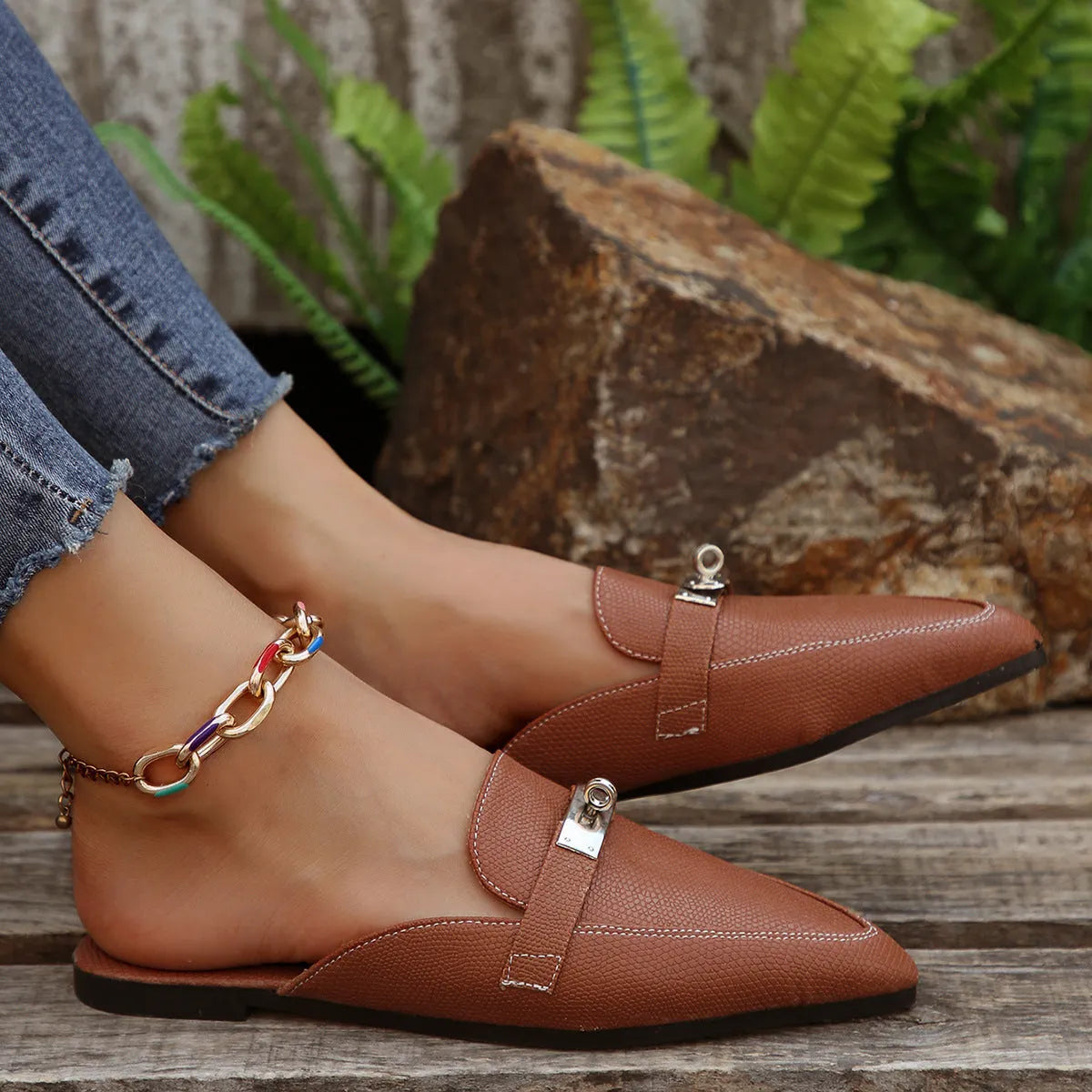 Light brown women's pointed toe slip-on shoes with low heel and rubber sole