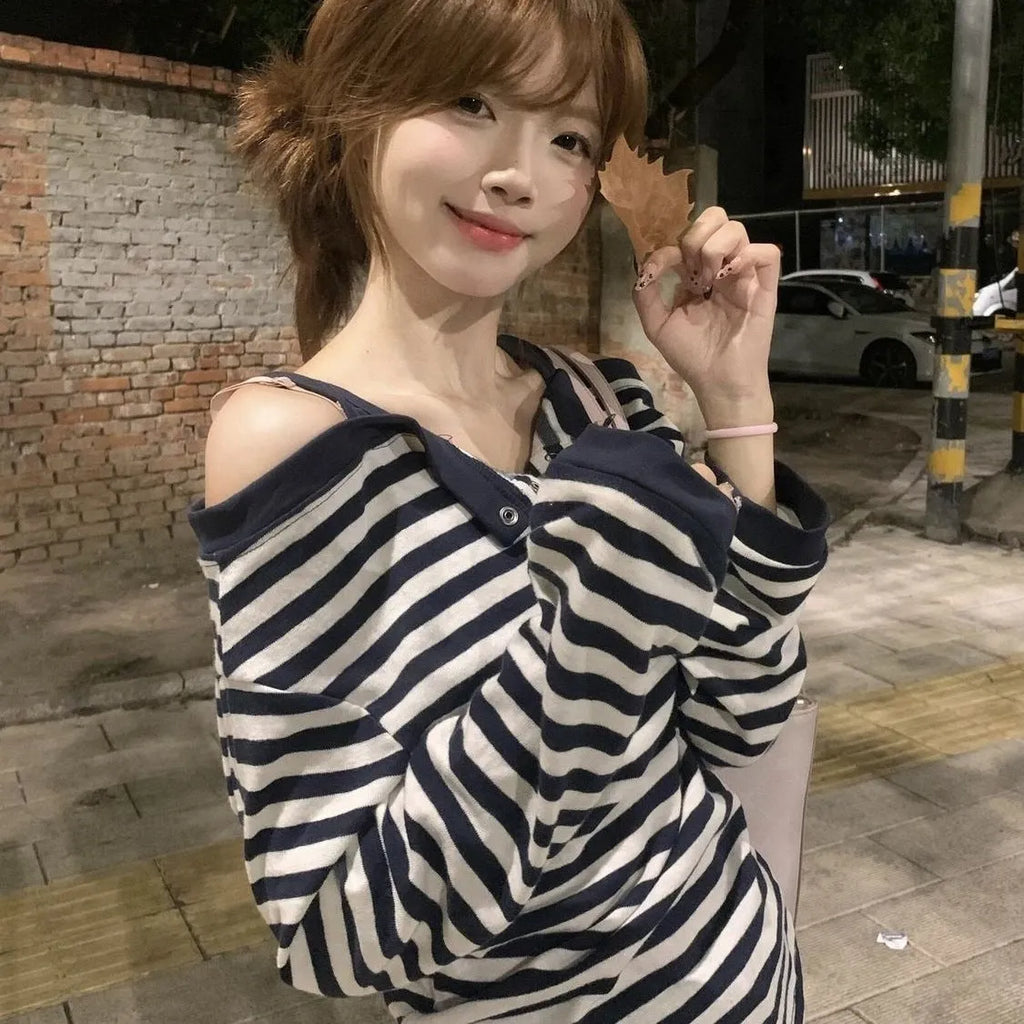 Dark blue Korean-style oversized women's long-sleeved T-shirt with embroidery and stripe details.