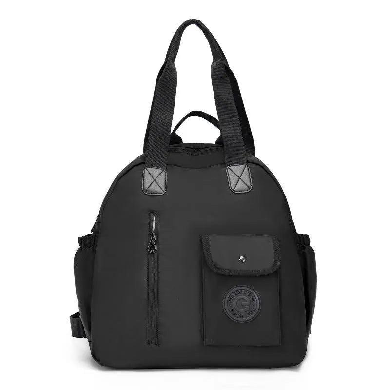 Large black nylon outdoor backpack with a front sandwich pocket, shown next to a khaki version.