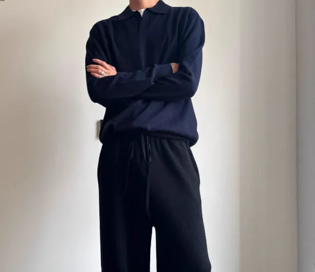 Man wearing a milky white pure wool polo sweater with a lapel collar and loose fit.