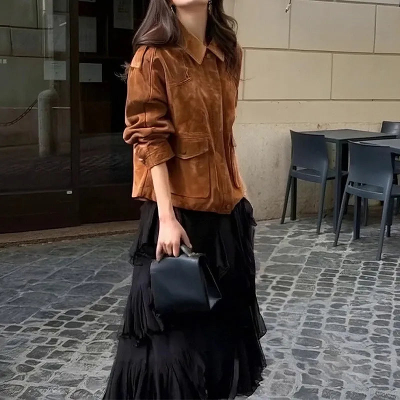 Bright brown women's suede-style polyester coat with regular sleeves on a hanger.