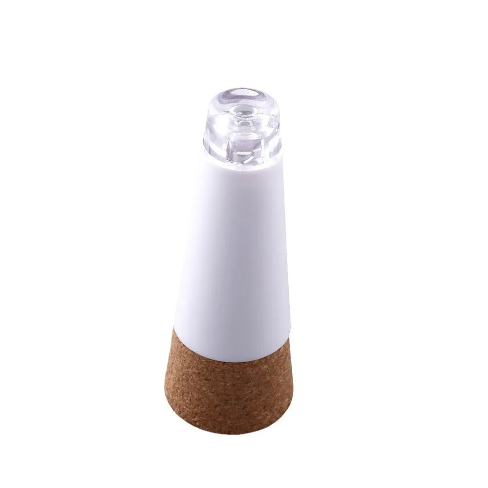 White plastic LED rechargeable luminous bottle cap cork light with integrated cork, shown on a wine bottle