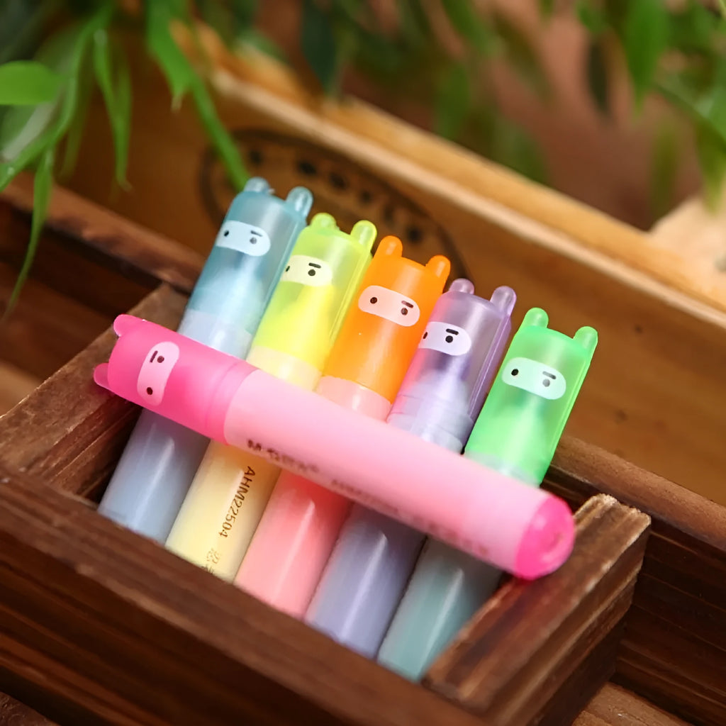Six highlighter pens with slanted oblique shape in plastic casing showing different colours
