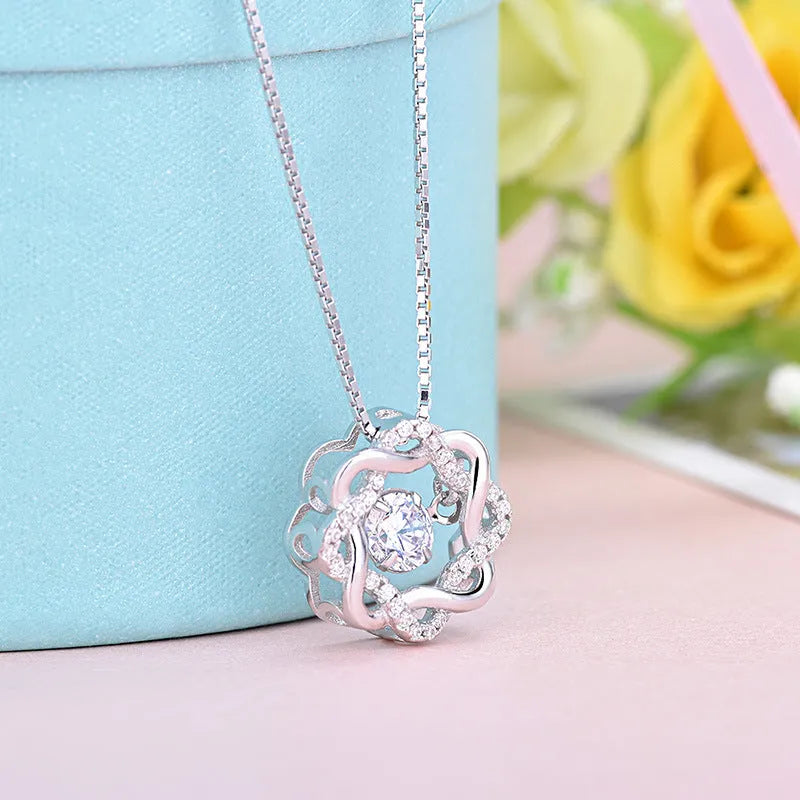 Fashion silver pendant set in rose gold white gold and silver colours on display
