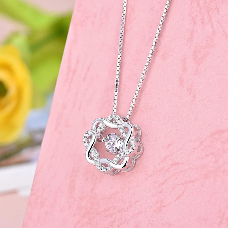 Fashion silver pendant set in rose gold white gold and silver colours on display