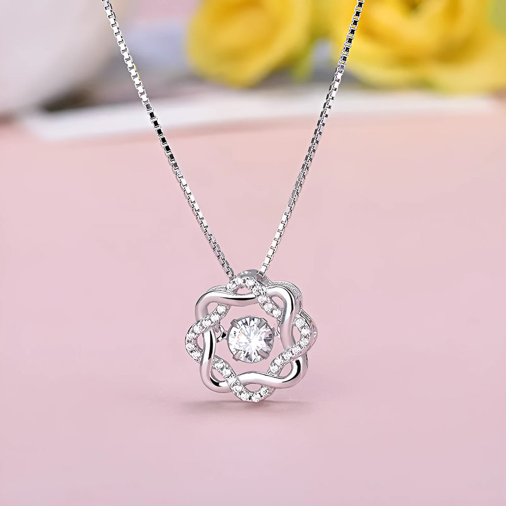 Fashion silver pendant set in rose gold white gold and silver colours on display