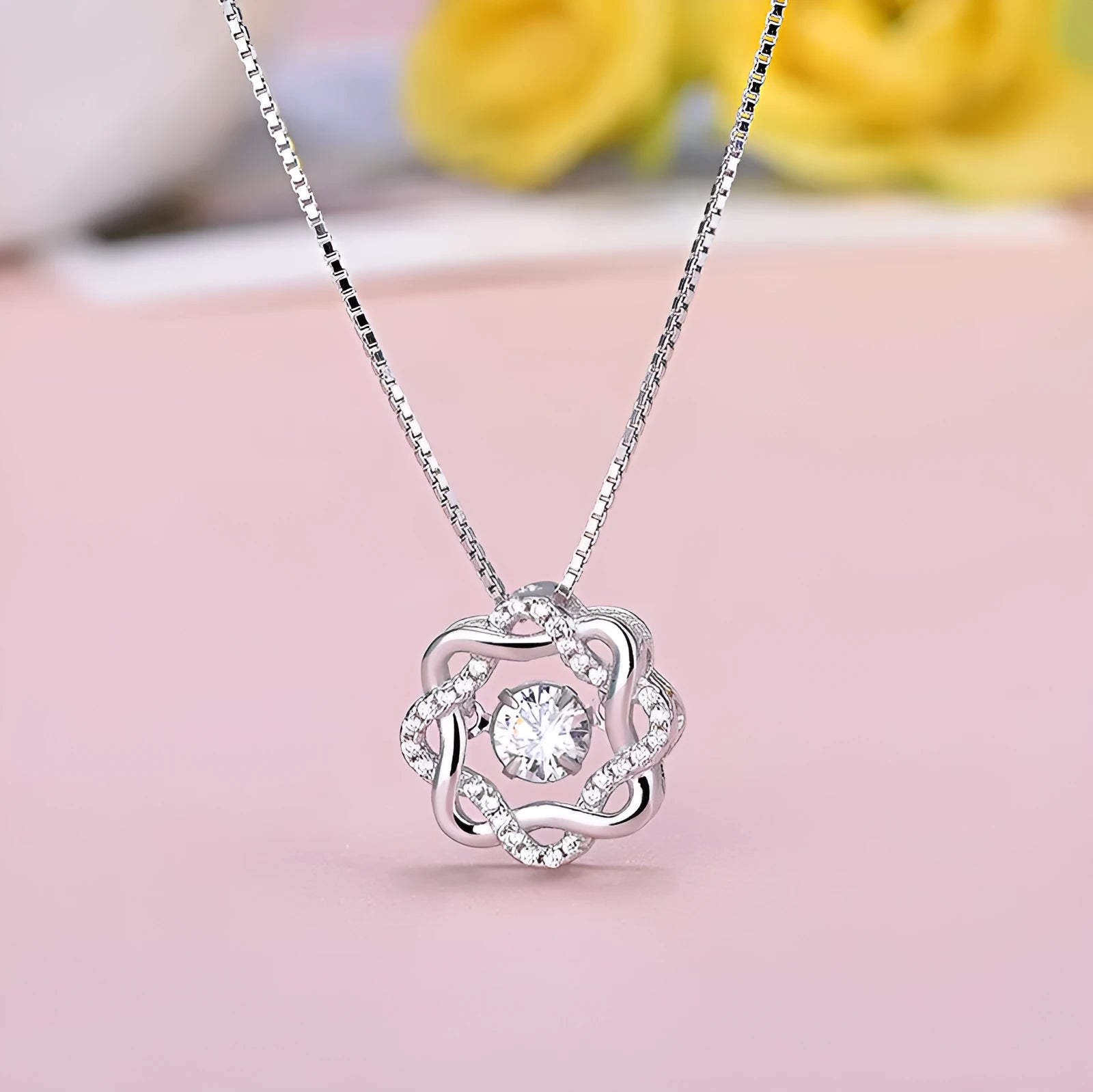 Fashion silver pendant set in rose gold white gold and silver colours on display