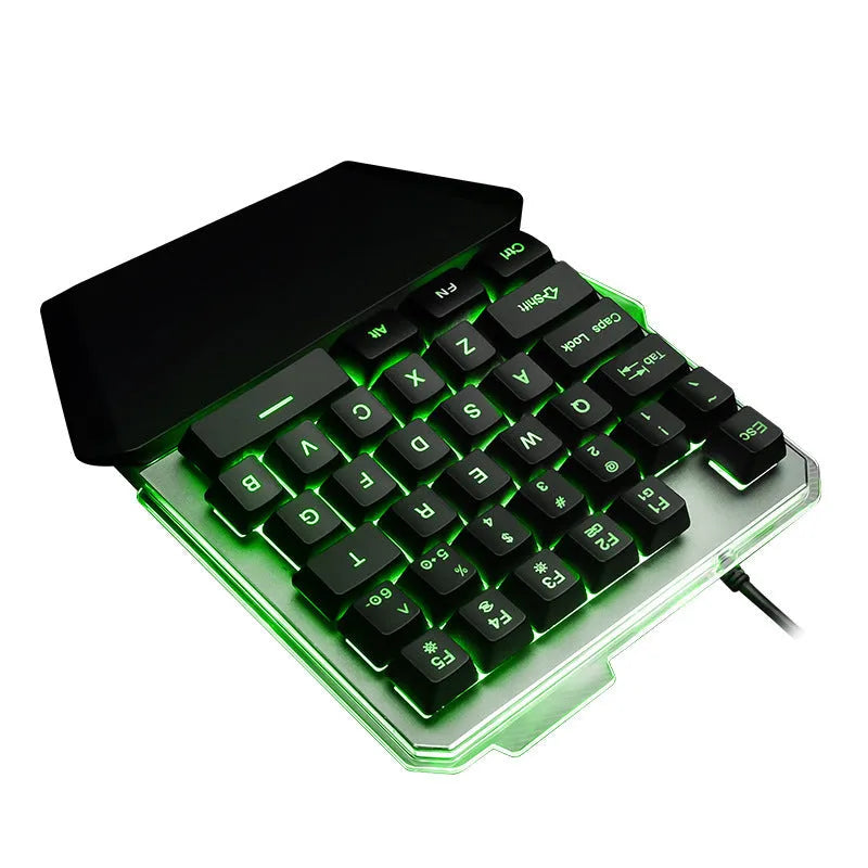 G40 Flow black one-handed mechanical keyboard with RGB backlit keys on a desk