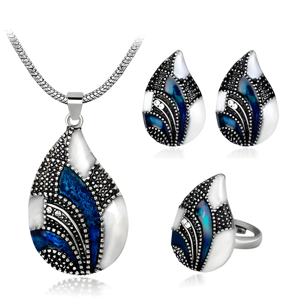 Gold water drop jewellery set with necklace, earrings, and ring on white background