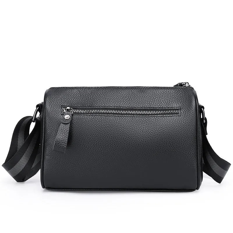 Black genuine leather one-shoulder crossbody bag showing front and interior with polyester lining
