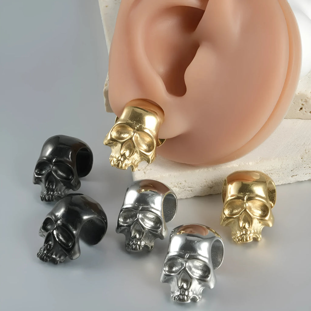 Stainless steel hollow skull and Buddha head design earrings in four colour options.