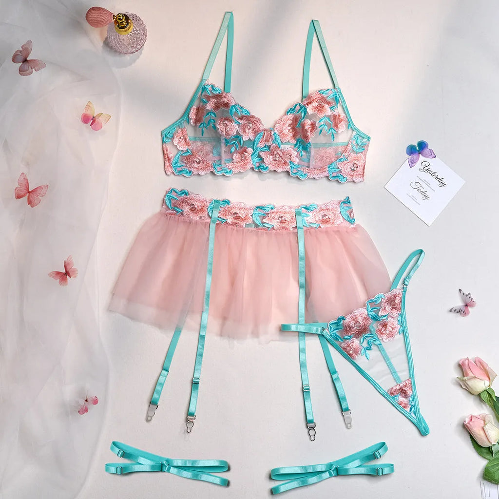 Pink women's mesh pettiskirt suit with embroidery detail, shown as a complete bikini set.