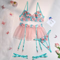 Pink women's mesh pettiskirt suit with embroidery detail, shown as a complete bikini set.