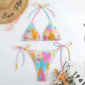 Women's triangle bag bikini swimsuit with printed floral gradient pattern and smocking detail
