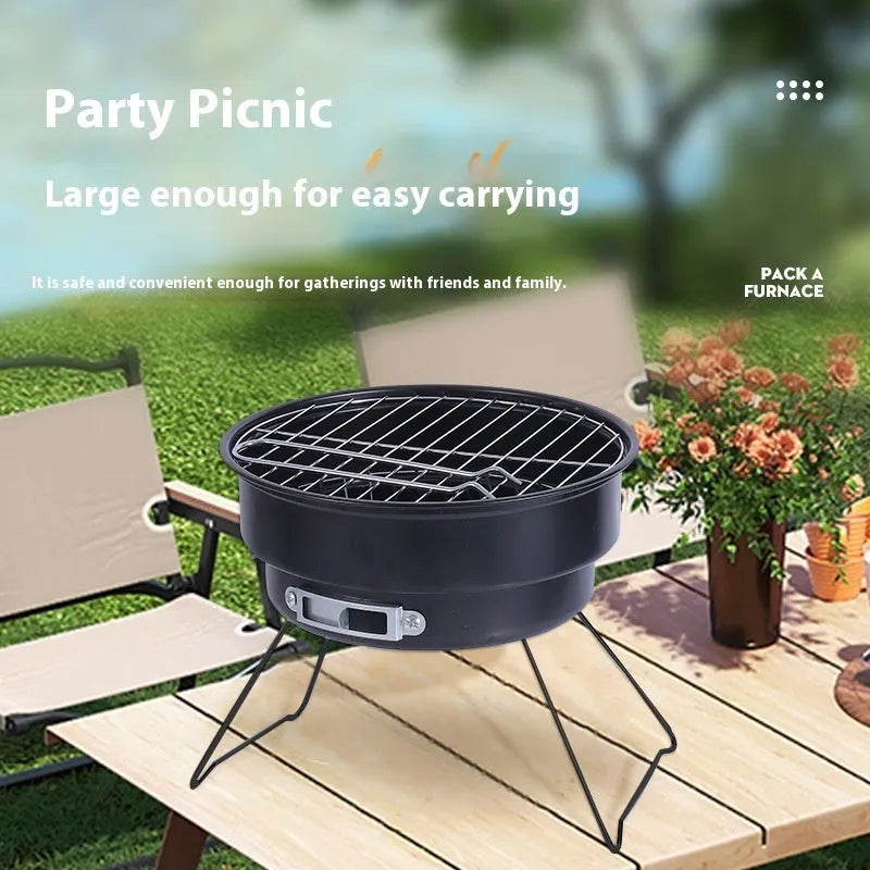 Small round folding metal ice stove with grill and foldable legs packed in a carry bag.