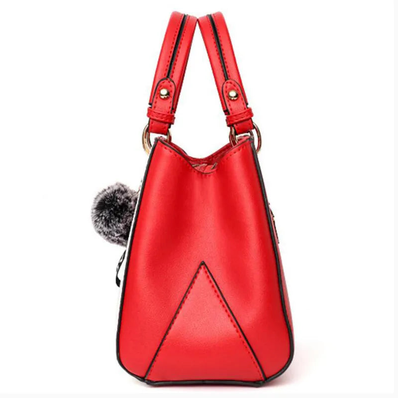 Women handbag made of PU leather with patchwork design and hairball ornaments in grey, pink, purple, and red colour options