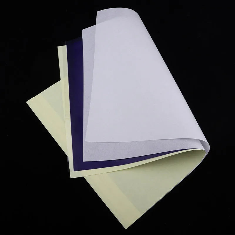A4 tattoo transfer paper sheets with clear guide lines and a tube of transfer paste gel.