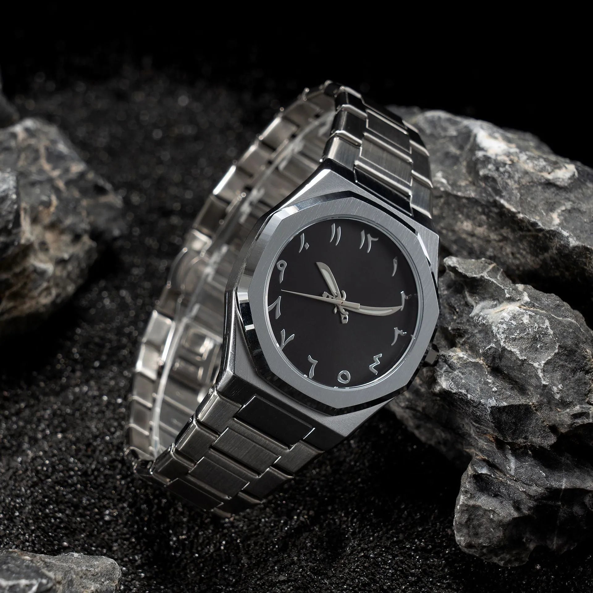 Men's business casual watch with steel bracelet showing black dial and silver scales