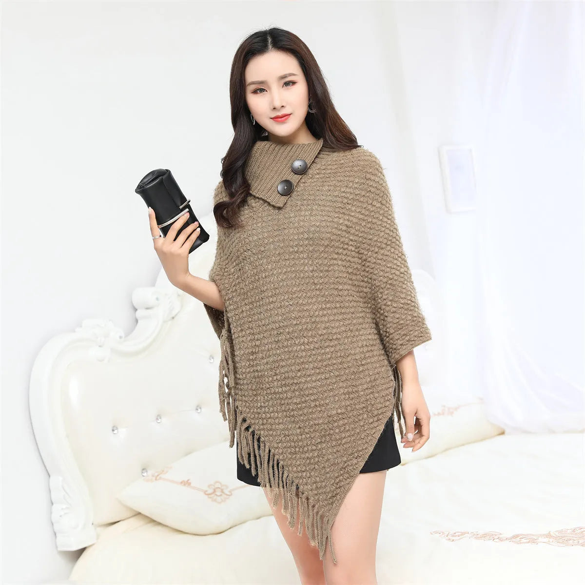 Women's sleeveless knit shawl cloak with dotted pattern in acrylic fibre shown in various colours